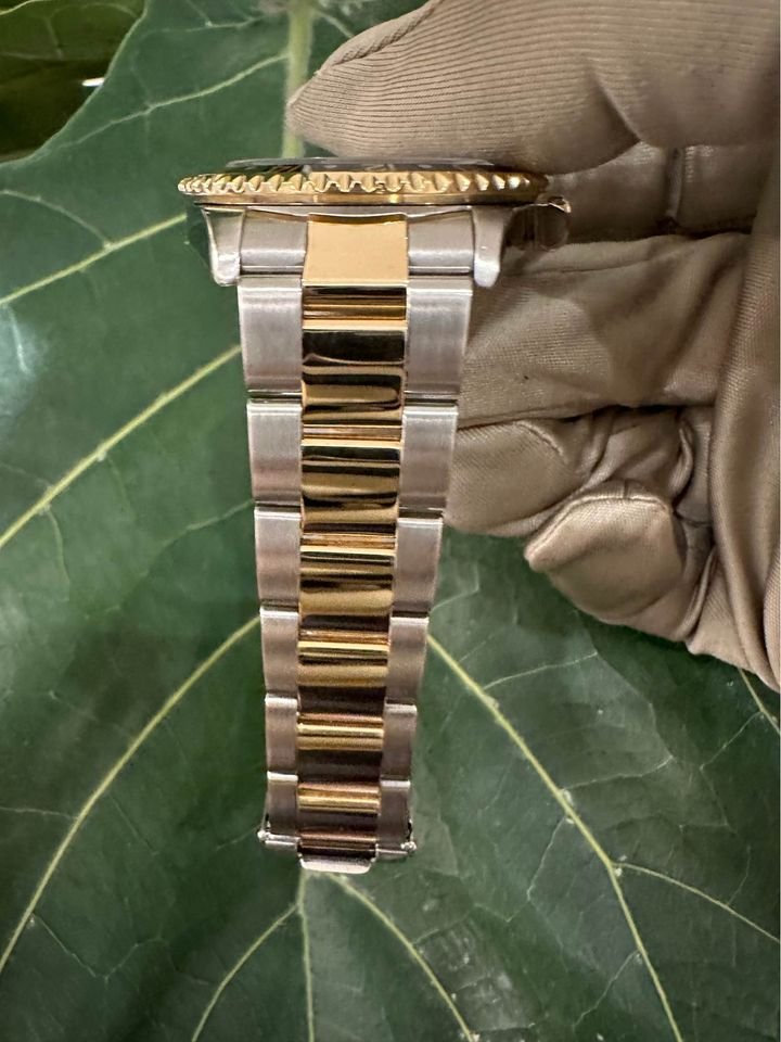 2005 Rolex GMT Master-II 16713 Grey Serti Diamond Ruby Dial TT Oyster - MyWatchLLC