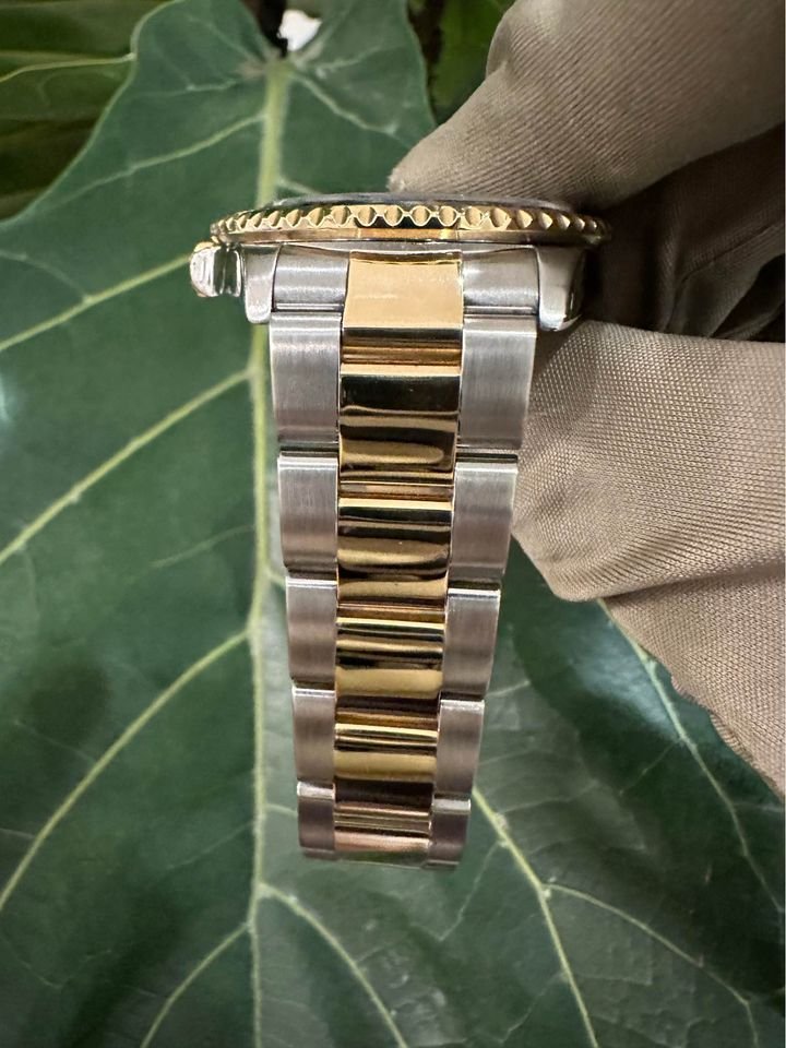 2005 Rolex GMT Master-II 16713 Grey Serti Diamond Ruby Dial TT Oyster - MyWatchLLC