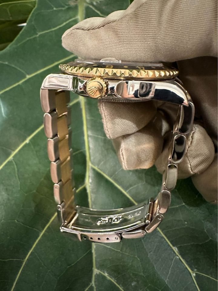 2005 Rolex GMT Master-II 16713 Grey Serti Diamond Ruby Dial TT Oyster - MyWatchLLC