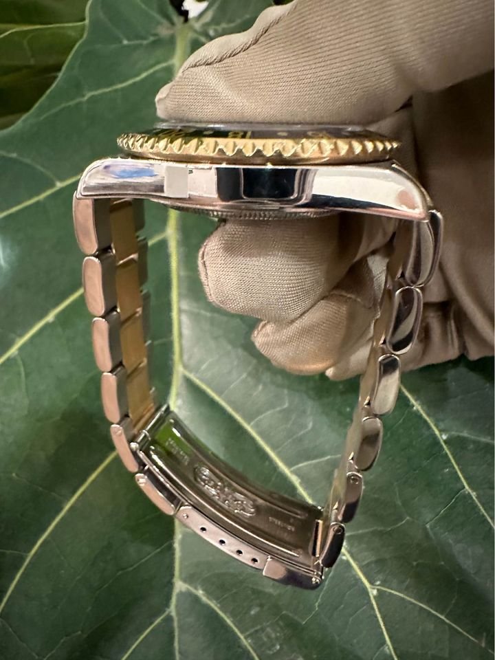 2005 Rolex GMT Master-II 16713 Grey Serti Diamond Ruby Dial TT Oyster - MyWatchLLC